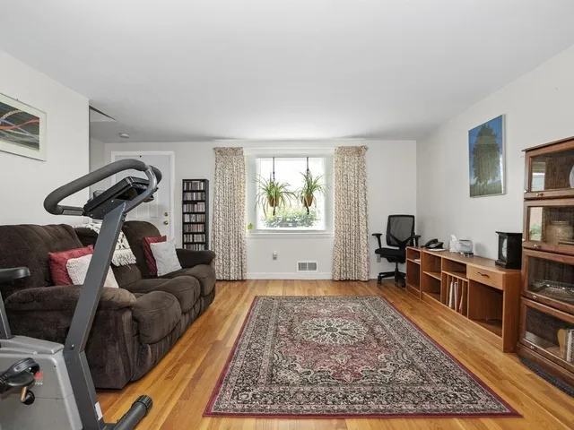 a living room with furniture or couch and a table