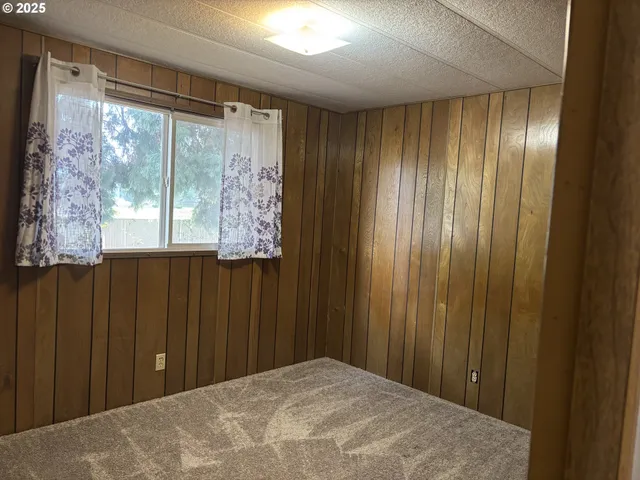 a view of a room with a wooden walls