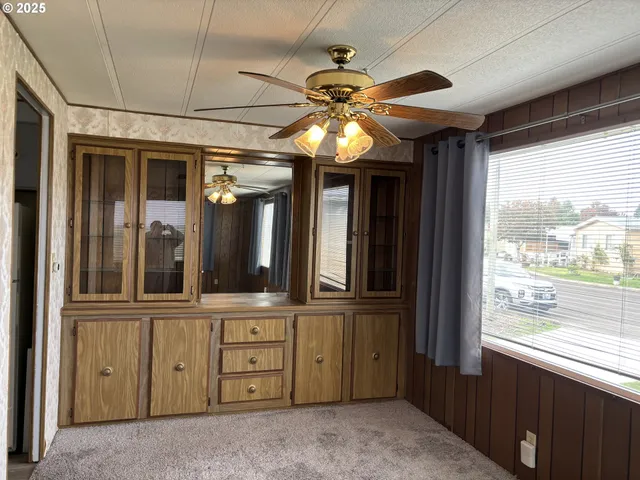 a view of a living room with a large window