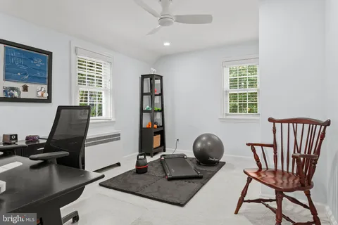 a workspace with furniture and window