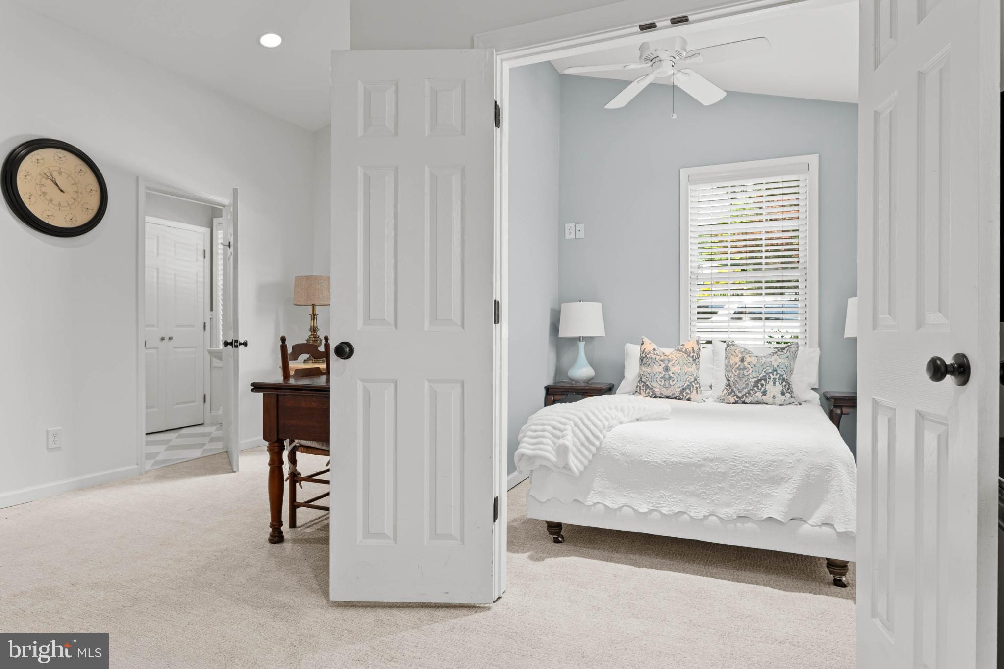 529 Covington Road Havertown, PA 19083 - Photo 28 of 34 a bedroom with a bed and a chandelier
