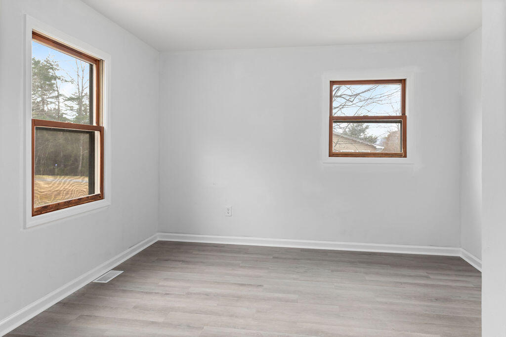 2883 Timber Ridge Buchanan, VA 24066 - Photo 11 of 39 a view of an empty room with wooden floor and a window