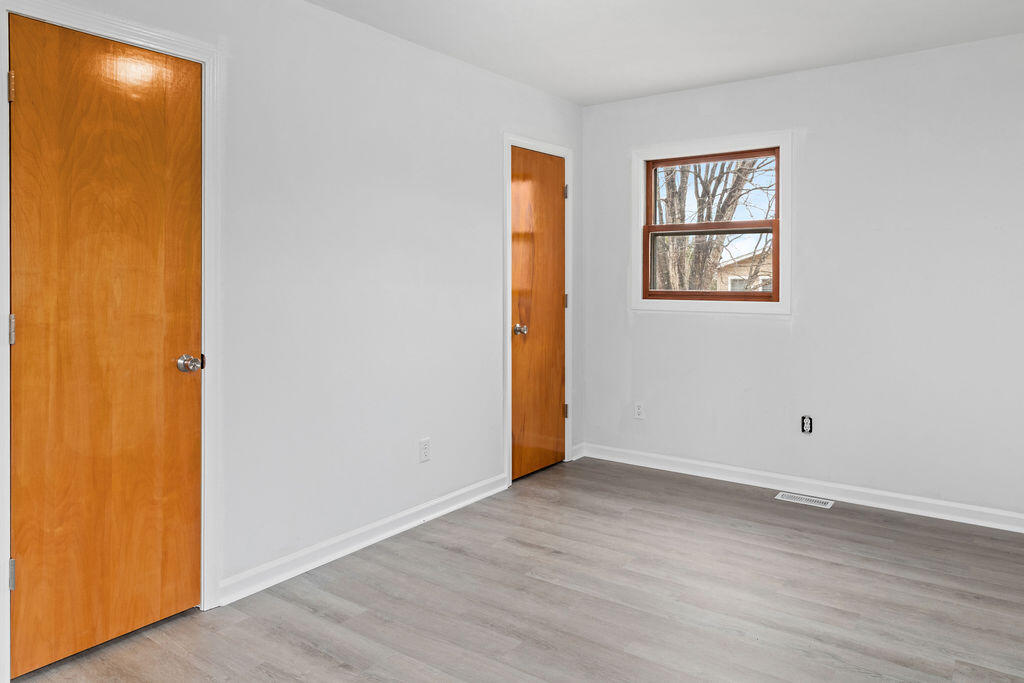 2883 Timber Ridge Buchanan, VA 24066 - Photo 12 of 39 an empty room with wooden floor and windows