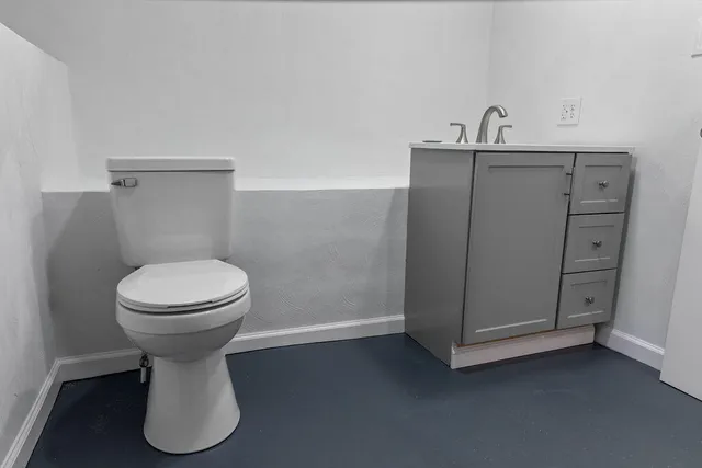 a bathroom with a glass shower door