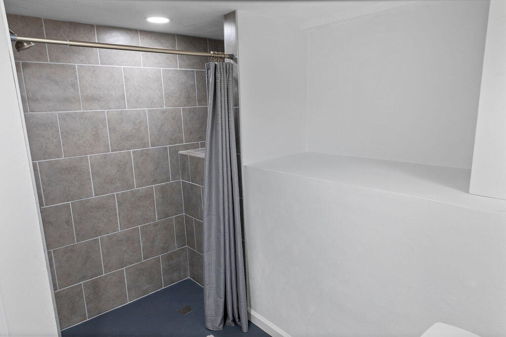 2883 Timber Ridge Buchanan, VA 24066 - Photo 20 of 39 a bathroom with a glass shower door