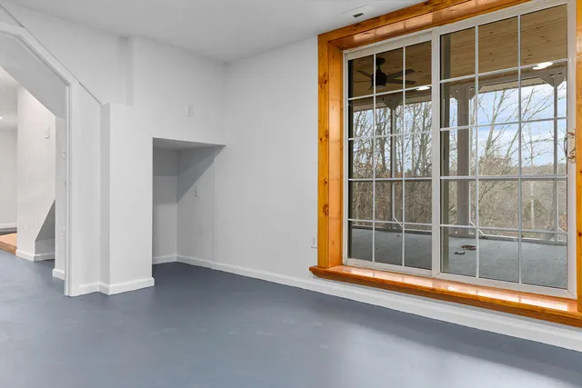 a view of a porch with wooden floor and a table