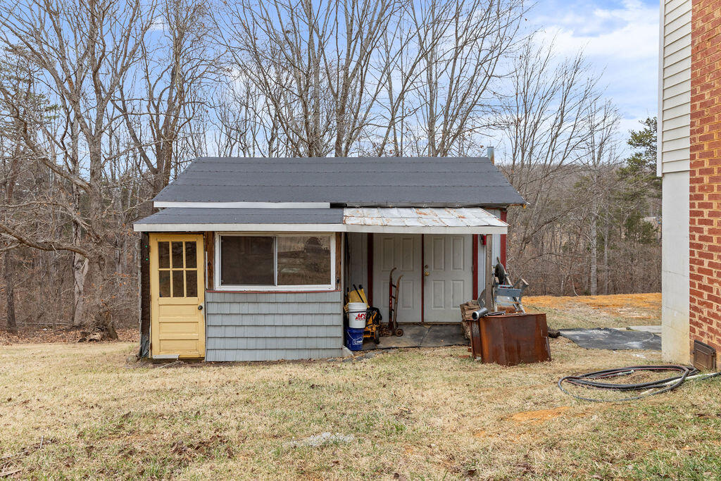 2883 Timber Ridge Buchanan, VA 24066 - Photo 30 of 39 a view of a house with a yard covered in snow