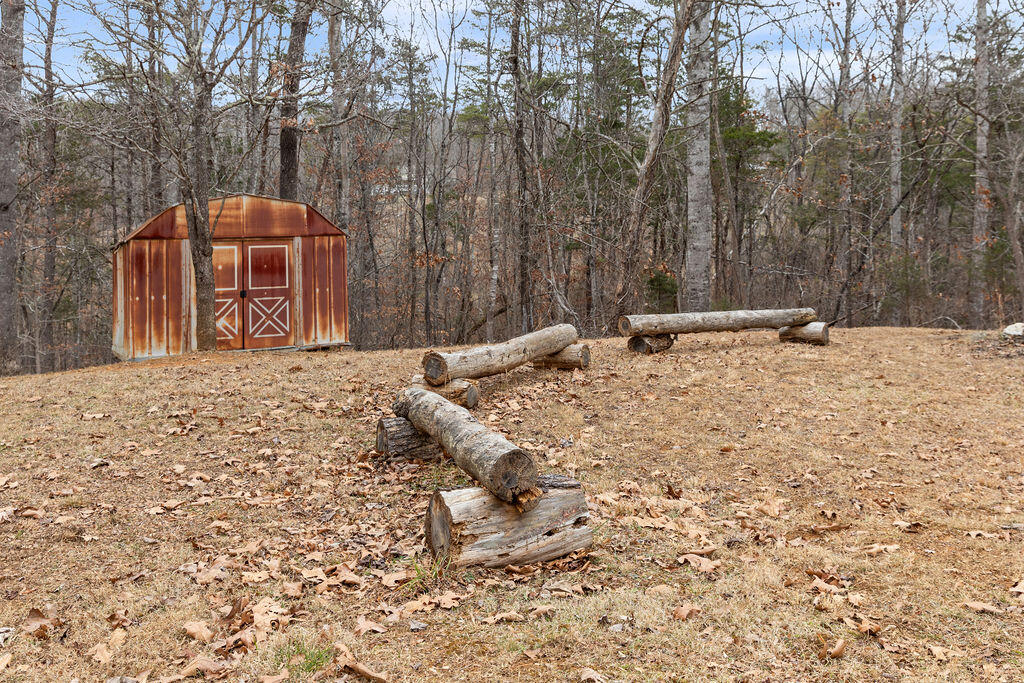 2883 Timber Ridge Buchanan, VA 24066 - Photo 34 of 39 a backyard of a house with trees and outdoor space
