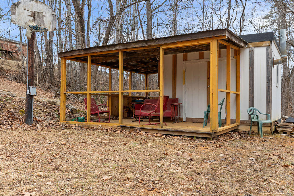 2883 Timber Ridge Buchanan, VA 24066 - Photo 35 of 39 a view of a wooden house with a small yard and large tree