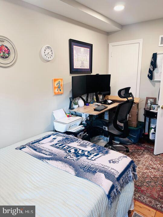 817 E Street Southeast, Unit 1 Washington, DC 20003 - Photo 12 of 25 a living room with a couch and a computer on a table