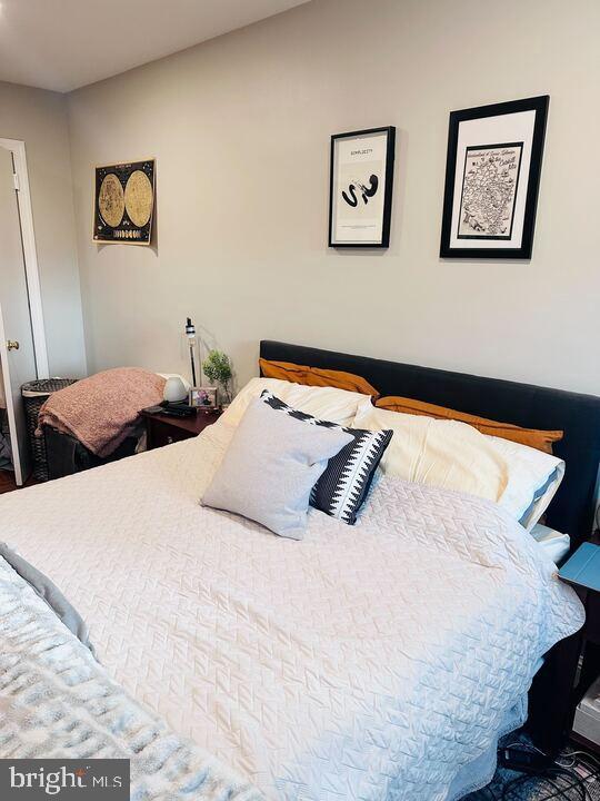817 E Street Southeast, Unit 1 Washington, DC 20003 - Photo 15 of 25 a bedroom with a bed and the wall painting