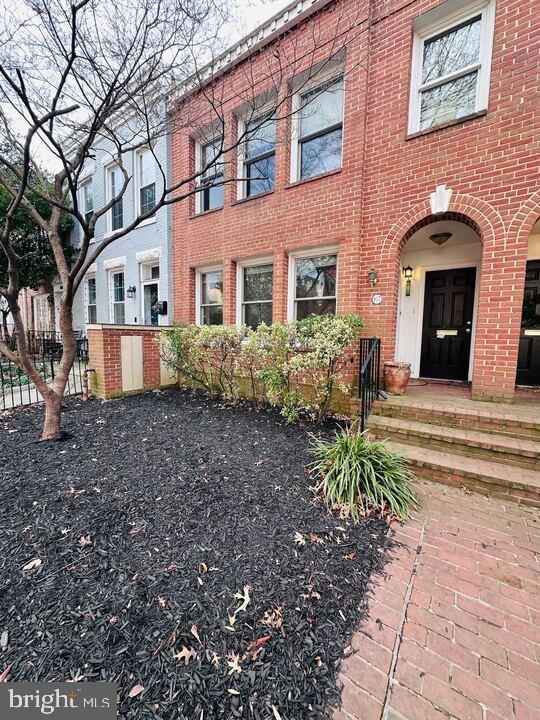 817 E Street Southeast, Unit 1 Washington, DC 20003 - Photo 2 of 25 a front view of a house with garden
