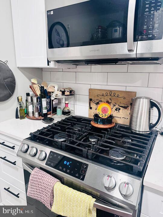 817 E Street Southeast, Unit 1 Washington, DC 20003 - Photo 22 of 25 a stove top oven sitting inside of a kitchen