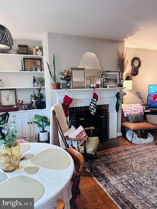 817 E Street Southeast, Unit 1 Washington, DC 20003 - Photo 23 of 25 a living room with furniture a rug and white walls
