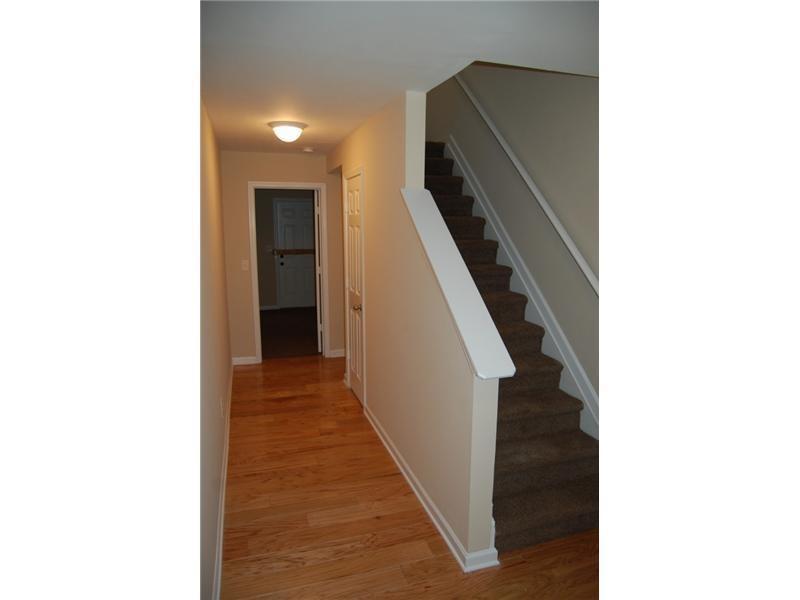618 Providence Place Southwest Atlanta, GA 30331 - Photo 2 of 8 a view of a hallway with wooden floor and staircase