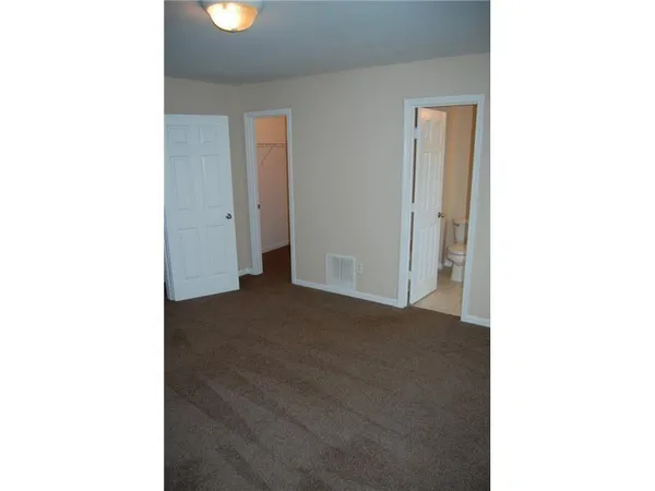 a view of a room with a open kitchen