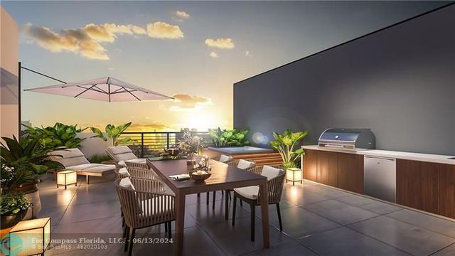 a view of a dining room with furniture and a potted plant