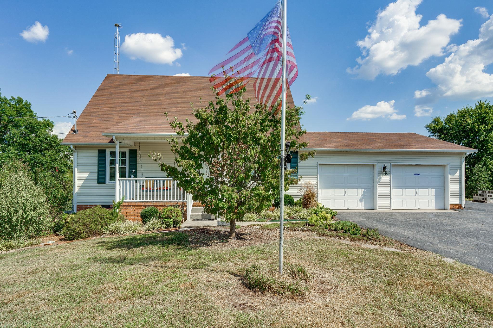2285 Zion Road Columbia, TN 38401 - Photo 3 of 25 Front view of the home with the American Flag blowing in the wind.