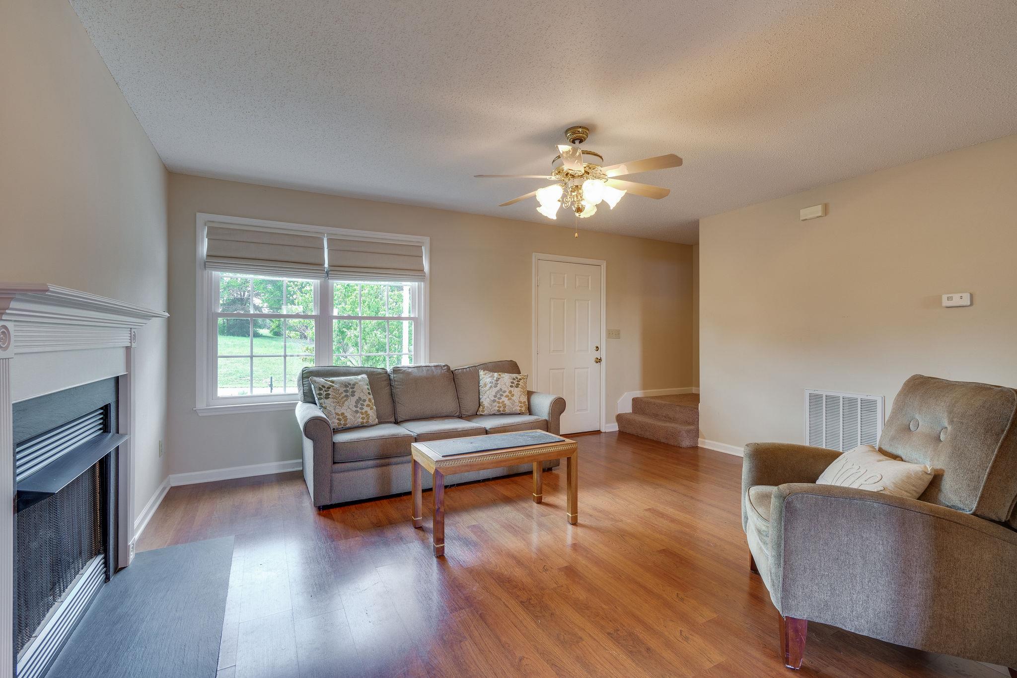 2285 Zion Road Columbia, TN 38401 - Photo 6 of 25 Living room with lots of natural light and a gas fireplace.