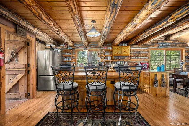 a kitchen with stainless steel appliances granite countertop a stove and a refrigerator