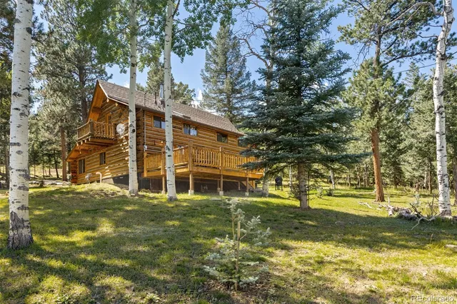 a view of brick house with large windows