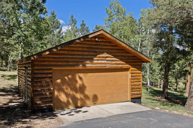 a view of a house with a yard from a balcony