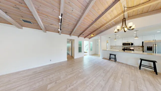a view of kitchen with cabinets and wooden floor