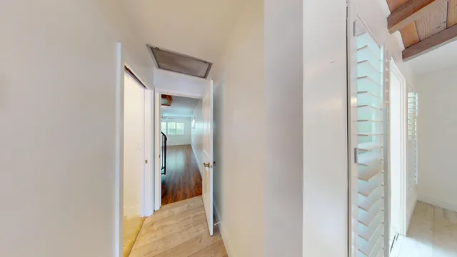a view of a bathroom from a hallway