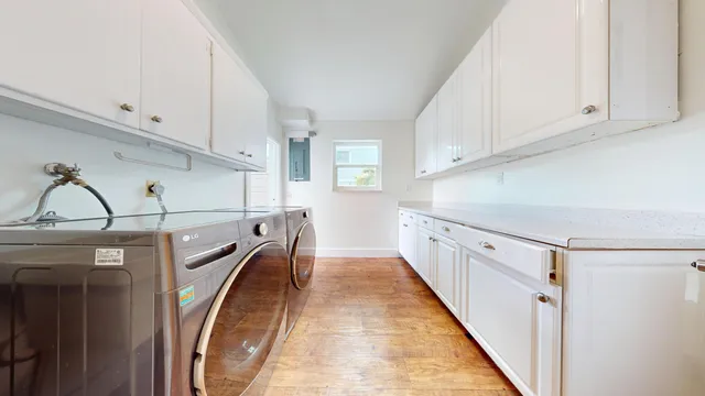 a view of a kitchen with washer and dryer
