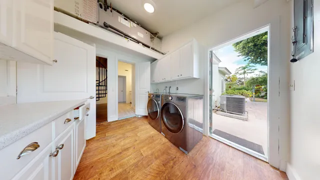 a view of a storage & utility room with wooden floor