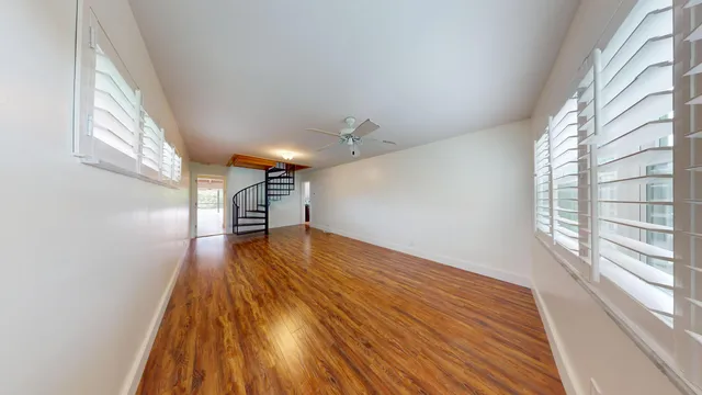 a view of staircase with a small kitchen