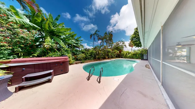 a view of a swimming pool with a yard
