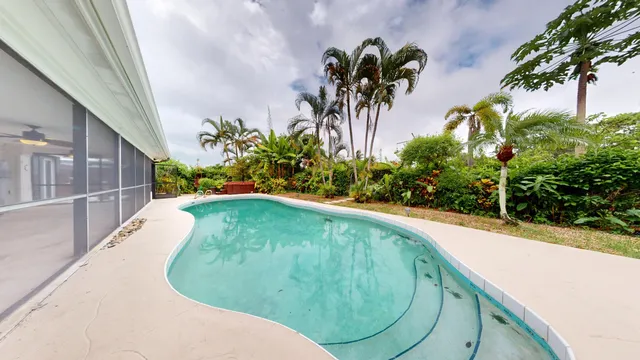 a view of swimming pool from a yard