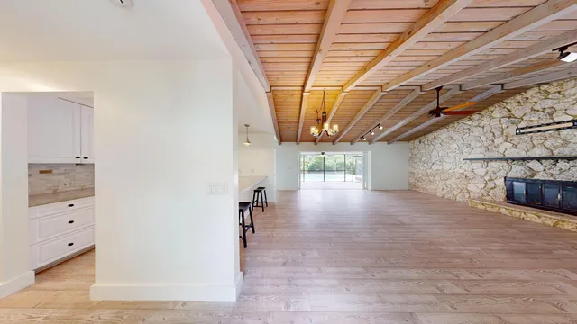 a view of a room with wooden walls