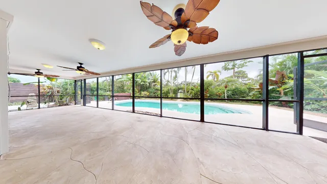 a view of an empty room with a large window