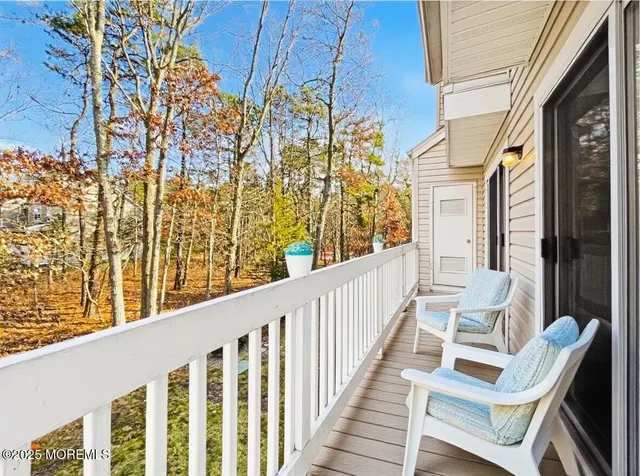 a view of balcony with furniture