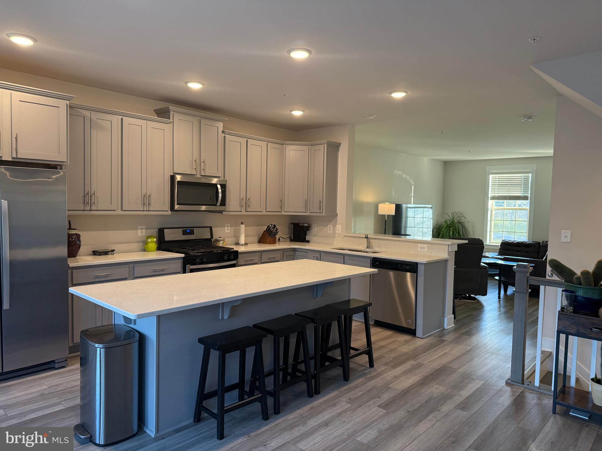 2932 Osprey Way North Frederick, MD 21701 - Photo 3 of 42 a large kitchen with kitchen island a sink table and chairs