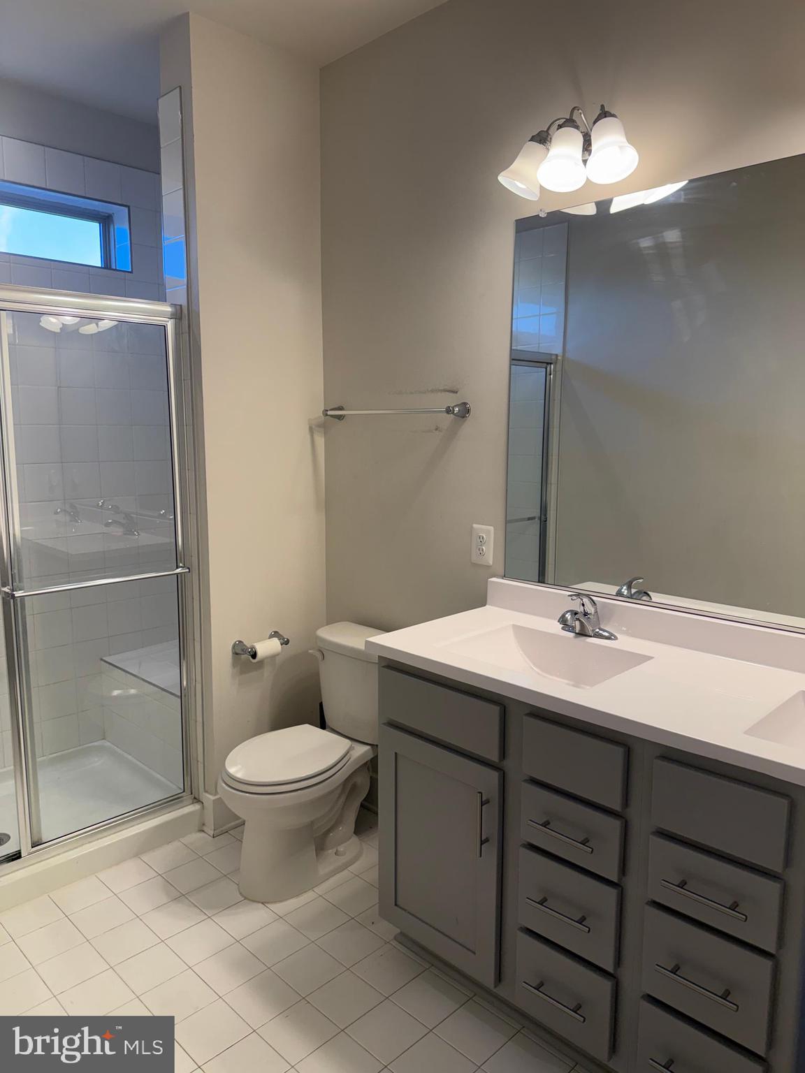 2932 Osprey Way North Frederick, MD 21701 - Photo 37 of 42 a bathroom with a toilet sink and mirror