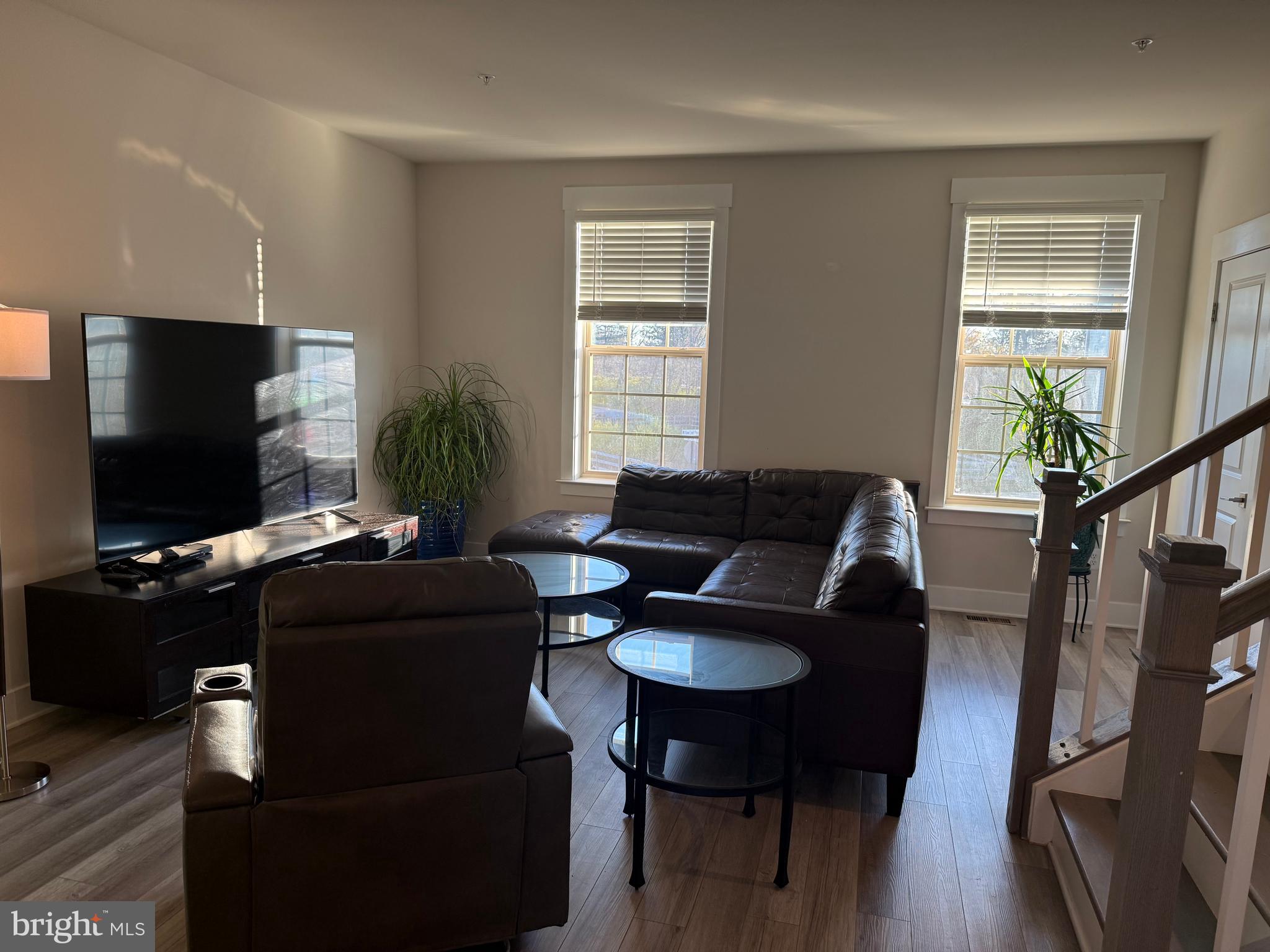 2932 Osprey Way North Frederick, MD 21701 - Photo 7 of 42 a living room with furniture and a flat screen tv