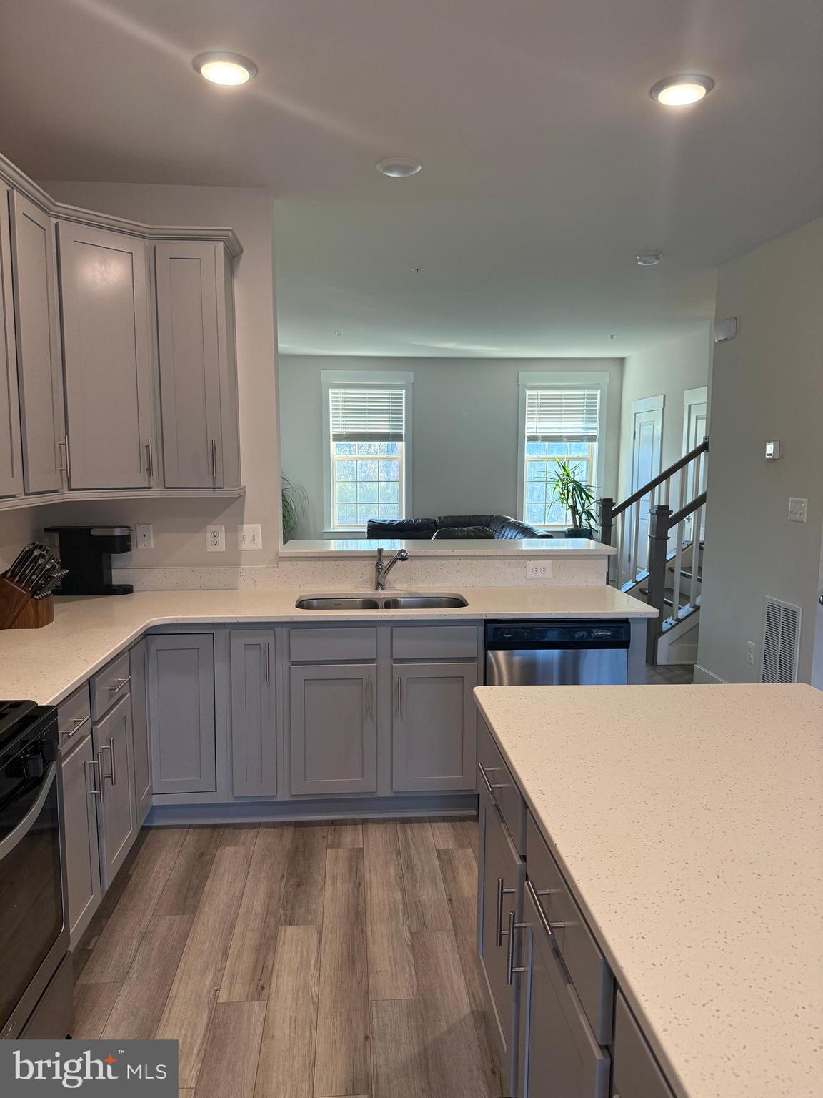 2932 Osprey Way North Frederick, MD 21701 - Photo 10 of 42 a kitchen with a sink a counter top space and appliances