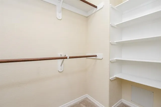 a view of a room with racks on the wall