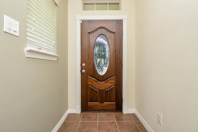 a view of a door of a house with washer and dryer