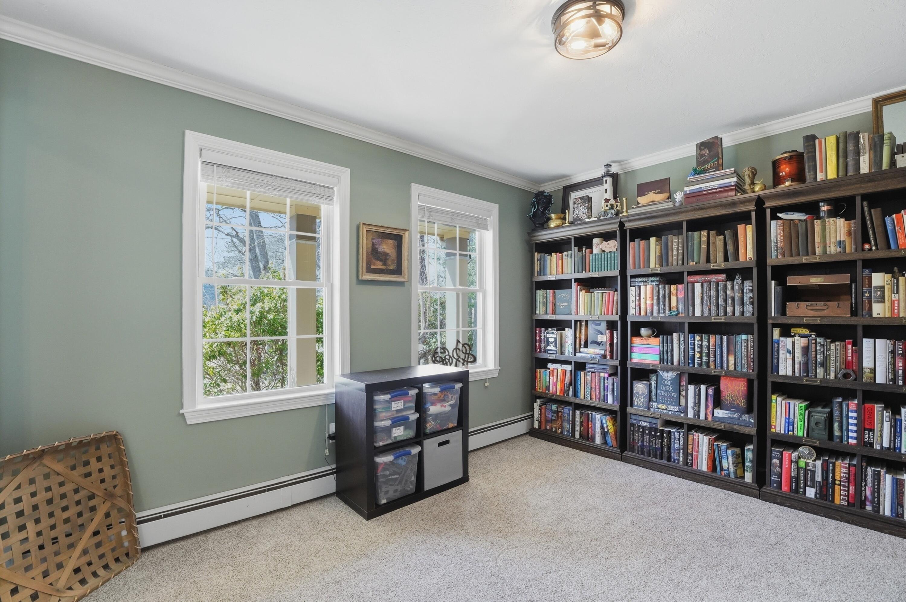 3 Dover Lane Buzzards Bay, MA 02532 - Photo 15 of 51 a livingroom with a large book shelf with books