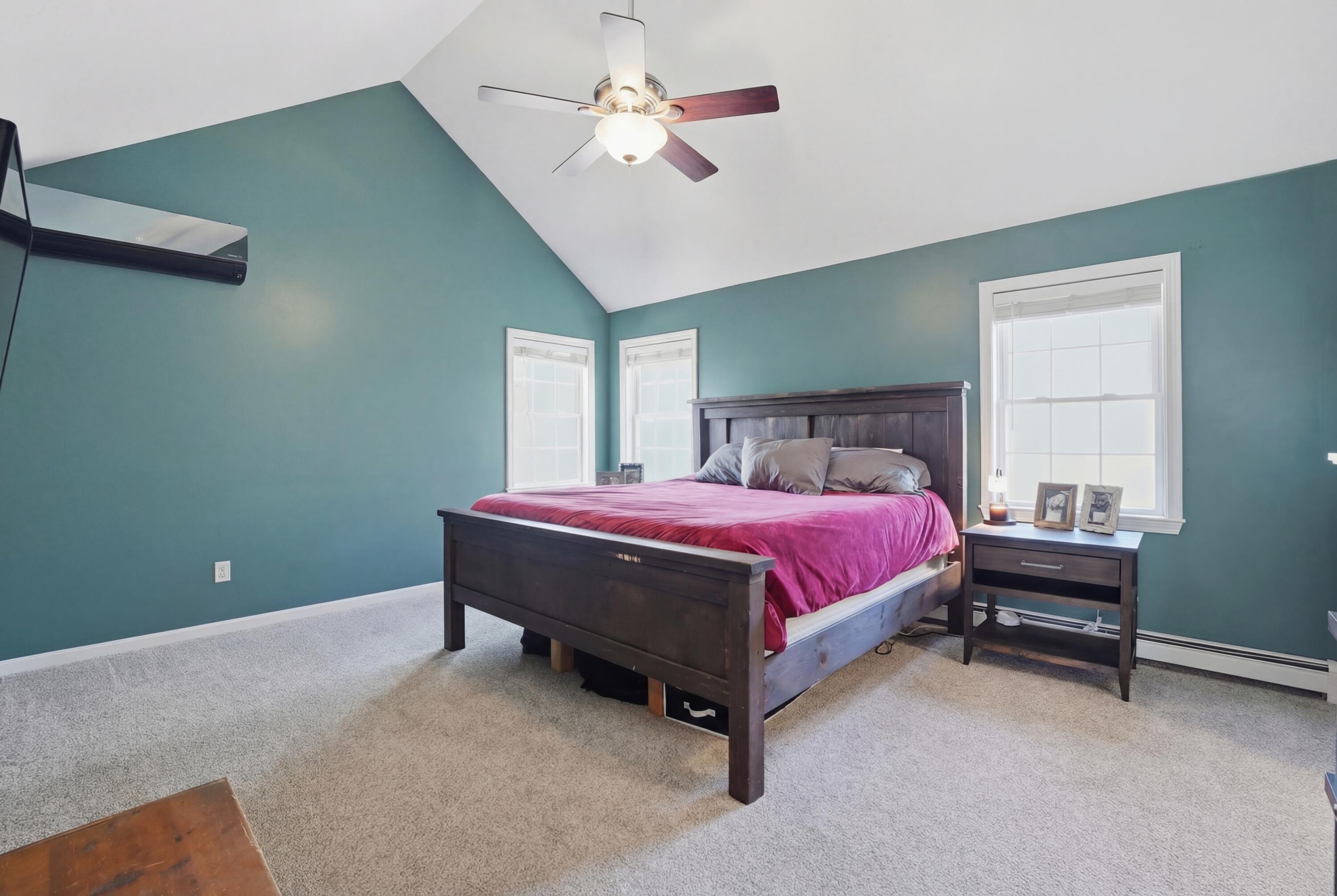 3 Dover Lane Buzzards Bay, MA 02532 - Photo 19 of 51 a spacious bedroom with a bed and a chandelier
