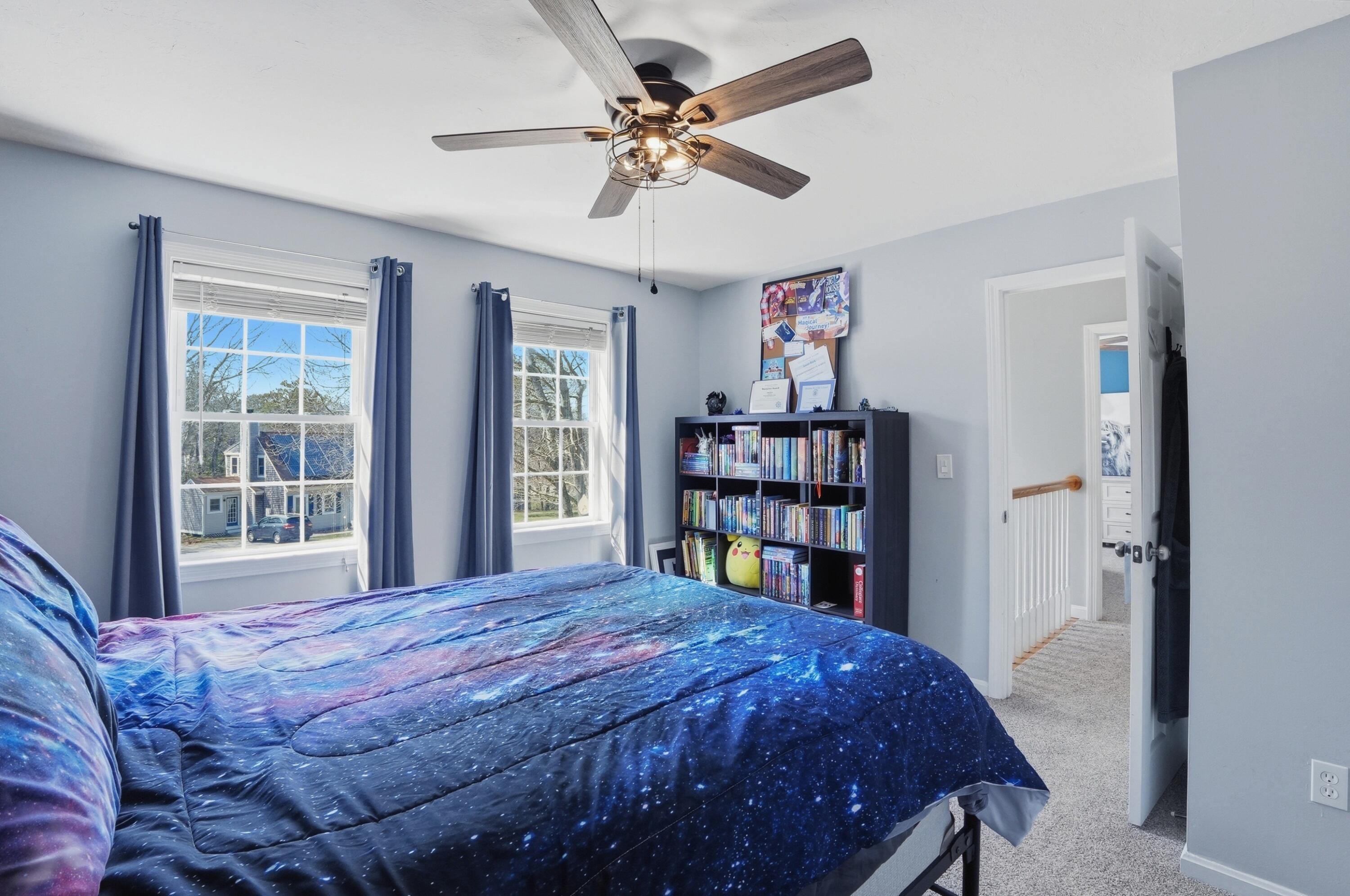 3 Dover Lane Buzzards Bay, MA 02532 - Photo 22 of 51 a bedroom with a bed a large window and a chandelier