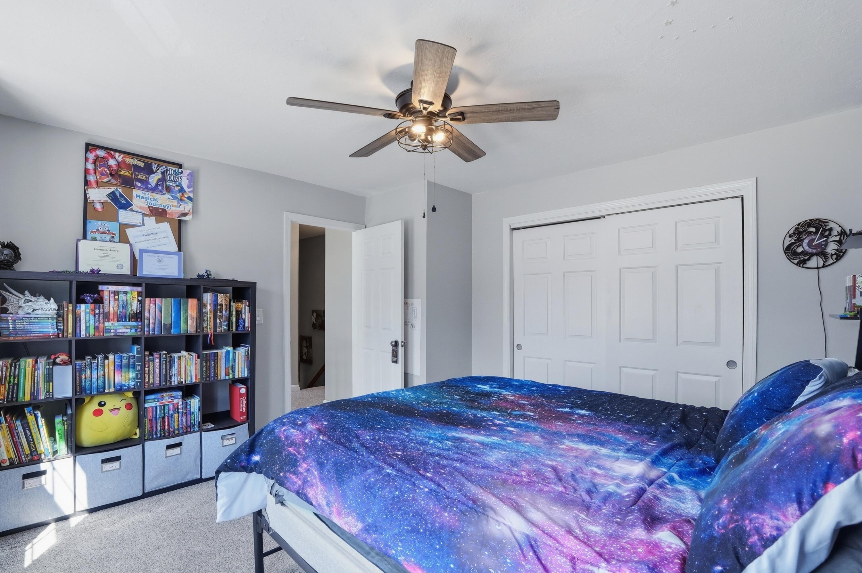3 Dover Lane Buzzards Bay, MA 02532 - Photo 23 of 51 a bedroom with a bed and a book shelf