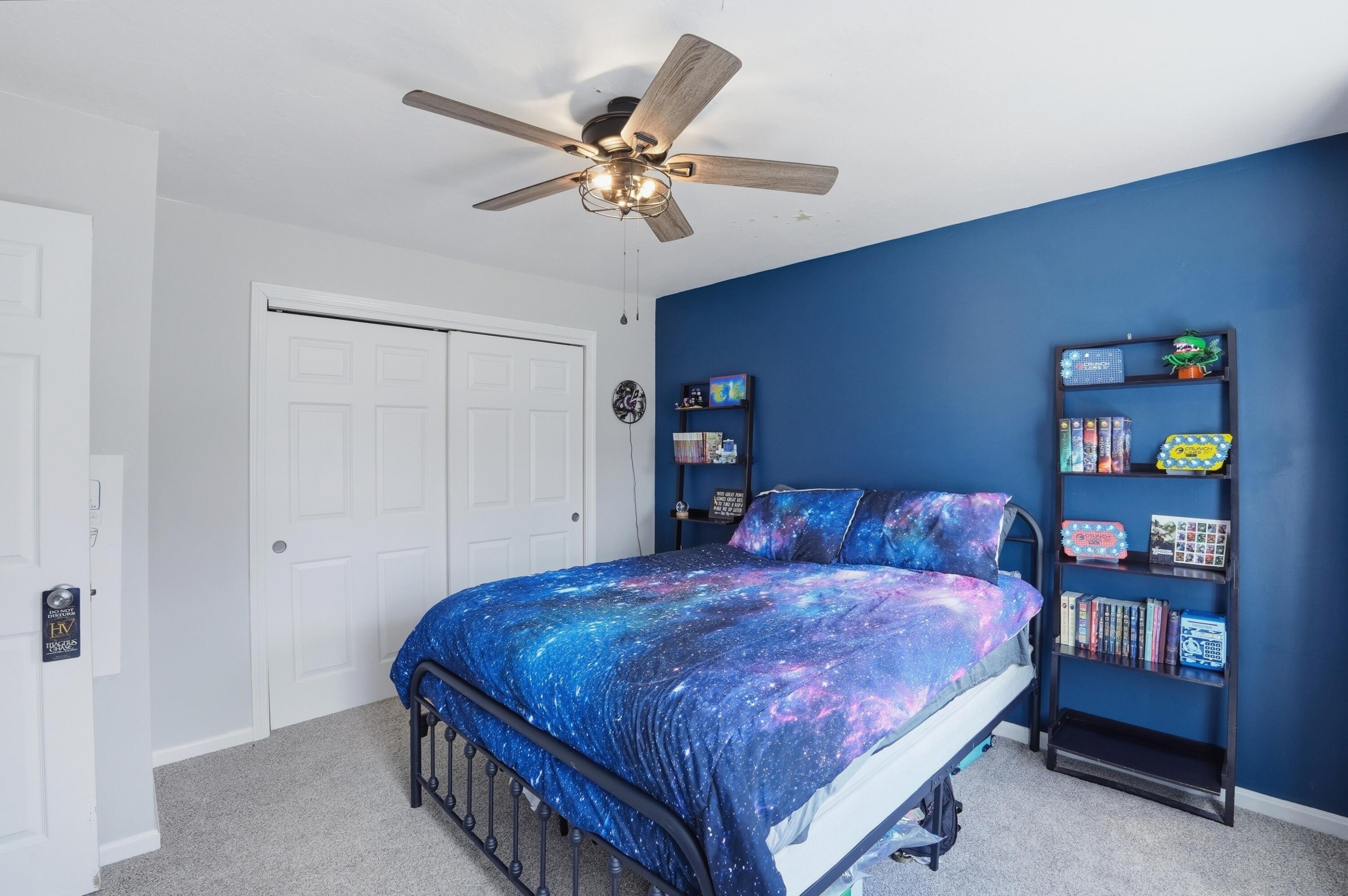 3 Dover Lane Buzzards Bay, MA 02532 - Photo 24 of 51 a bedroom with a large bed and a chandelier