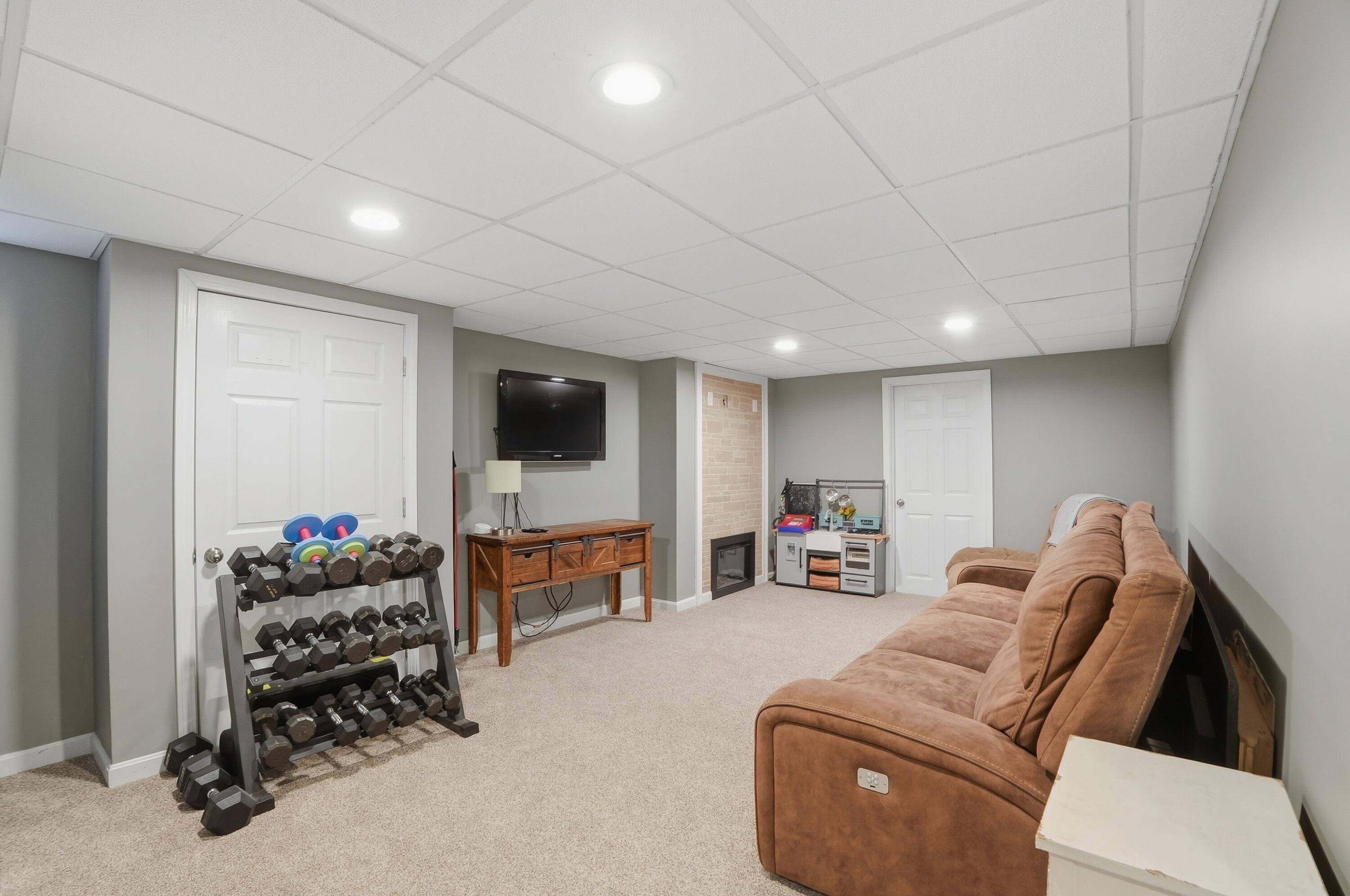 3 Dover Lane Buzzards Bay, MA 02532 - Photo 29 of 51 a living room with furniture and a flat screen tv