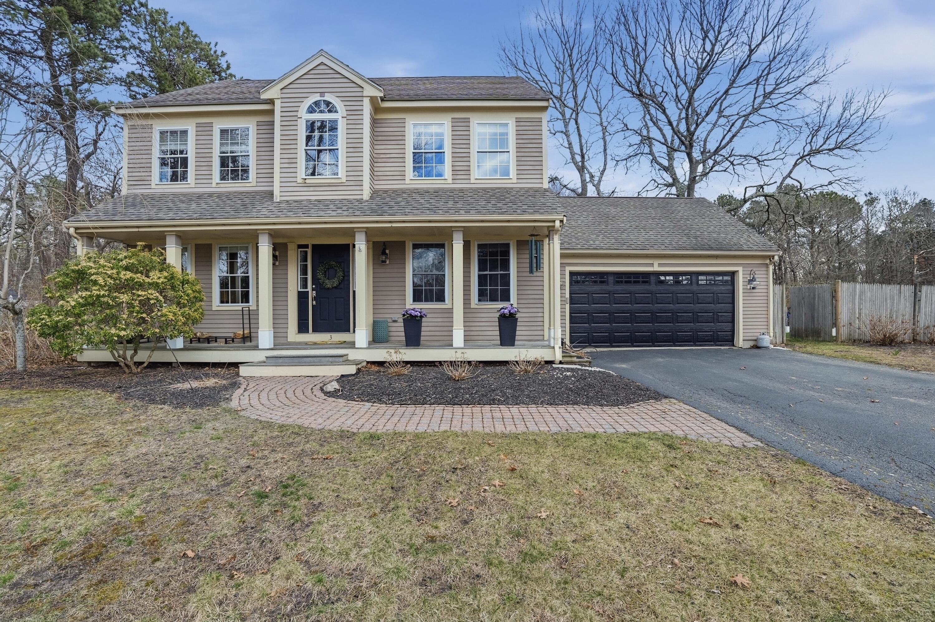 3 Dover Lane Buzzards Bay, MA 02532 - Photo 33 of 51 a front view of a house with a yard and garage