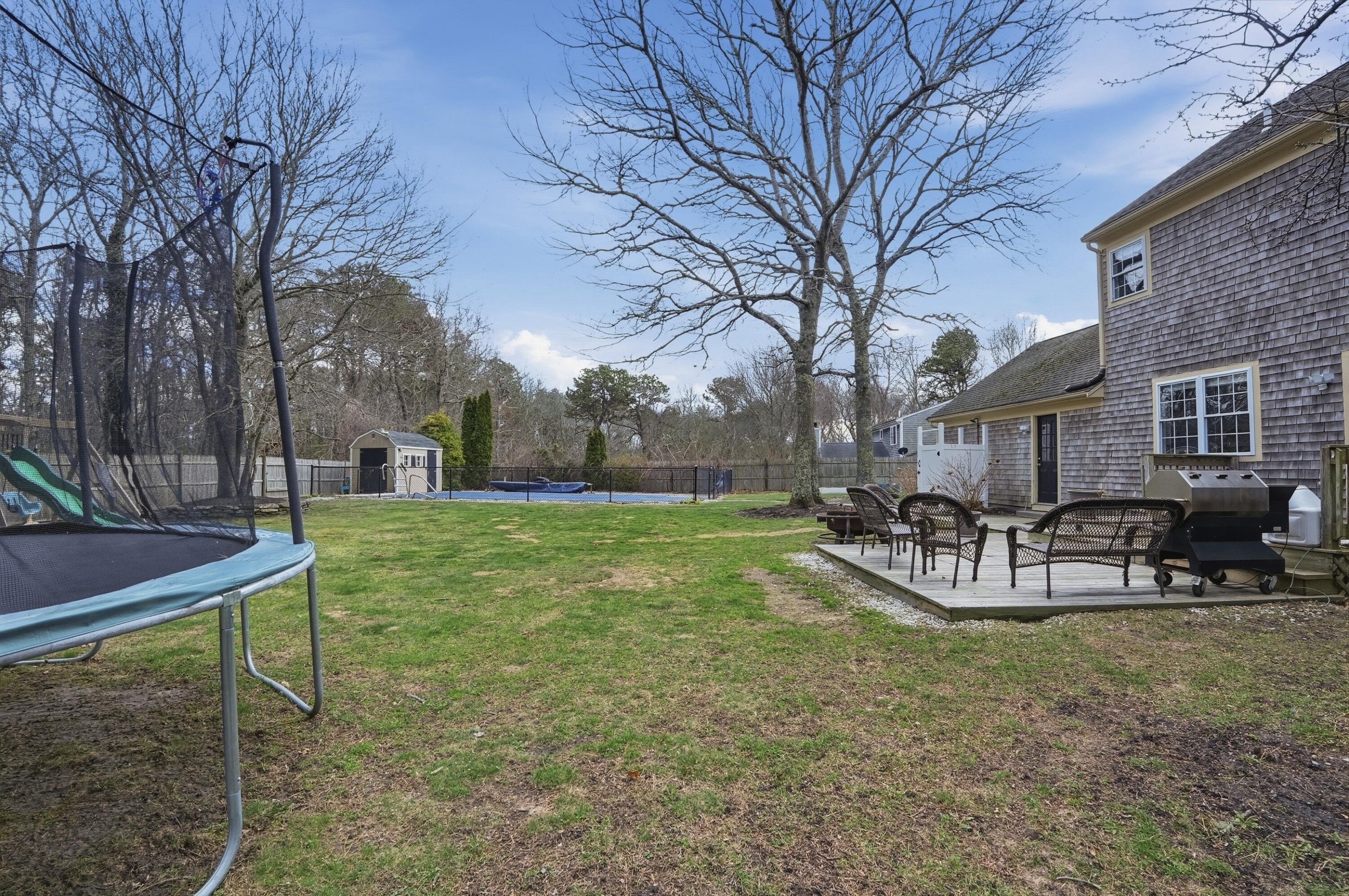 3 Dover Lane Buzzards Bay, MA 02532 - Photo 41 of 51 a view of a house with backyard porch and sitting area